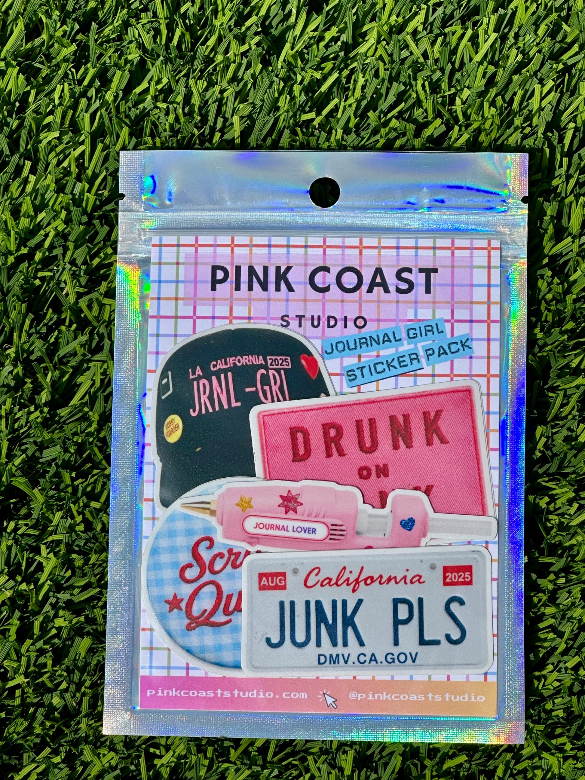 Pink Coast Studio sticker pack on grass