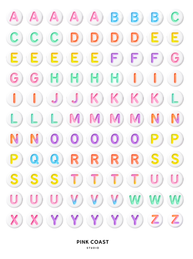 A sheet of alphabet stickers featuring uppercase letters A through Z in pastel rainbow colors, arranged in rows on a white background. The brand name 'PINK COAST STUDIO' is printed at the bottom.